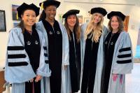 PhD students posing at Graduation